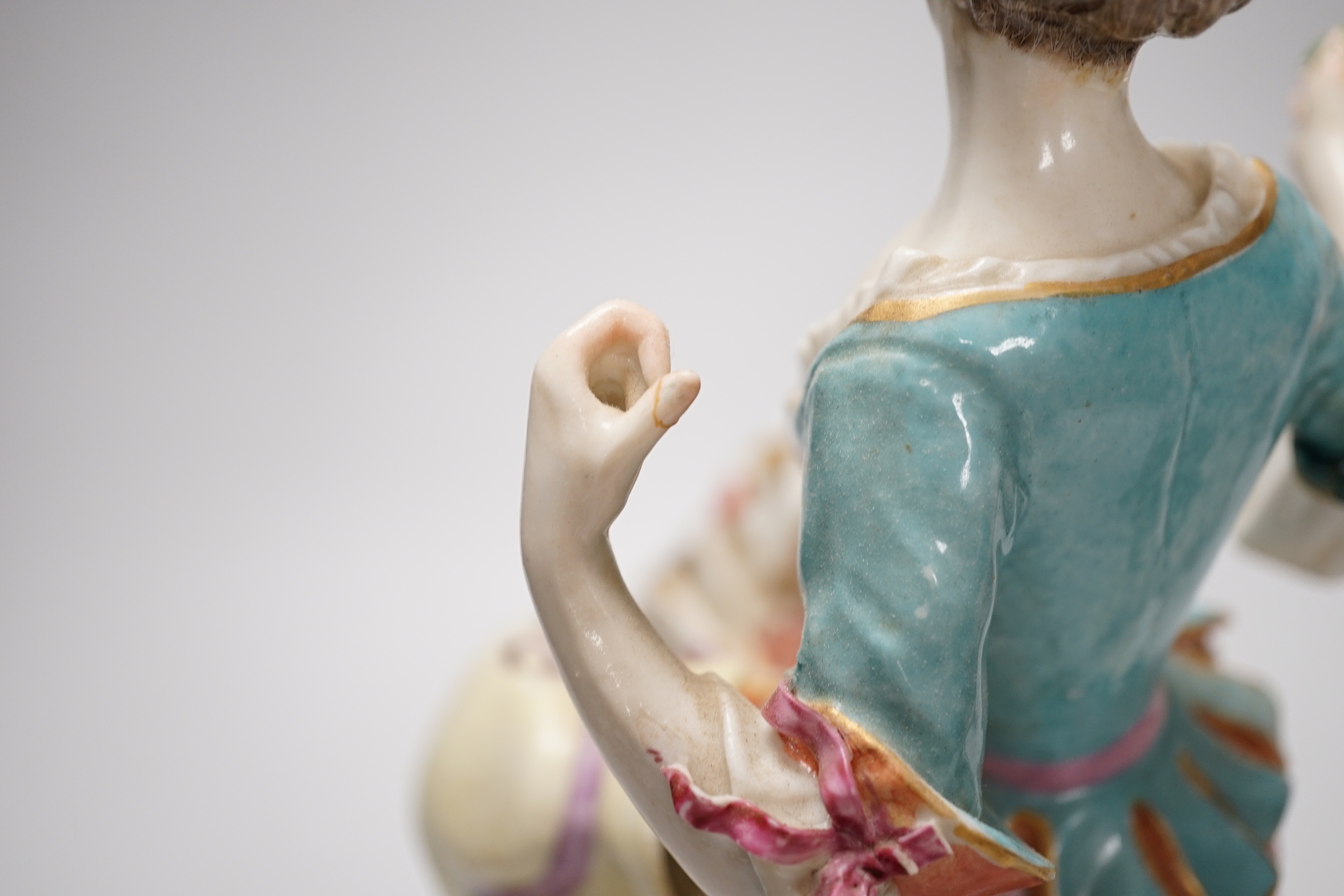 A pair of Chelsea Derby figures, seated male and female, 27.5cm